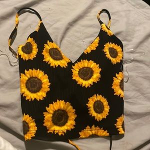 From forever 21. Size small , black with sunflowers all over, crossed back